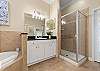 Primary Ensuite with Soaking Tub, Separate Shower, and Double Vanities.