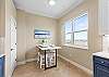 Custom Kitchen Table to match the counters is a great spot to grab a snack at or set up as a work space. 