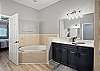 Primary Ensuite with soaking tub and separate shower. 