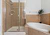 Primary Ensuite with soaking tub, separate shower and dual vanities. 