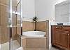Primary Ensuite with soaking tub, separate shower and dual vanities. 