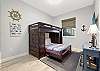 3rd Bedroom has a nautical theme with a Twin over Full Bunk and TV.