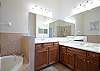 Master Bathroom features Dual Vanities, separate shower and soaking tub.  