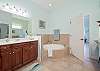 Master Bathroom features double vanities, shower and separate soaking tub.