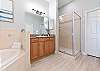 King Primary Esuite with Soaking tub, Separate Shower and Double Vanities. 