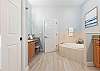 King Primary Esuite with Soaking tub, Separate Shower and Double Vanities. 