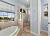 King Master Ensuite with soaking tub, separate shower and dual vanity. 