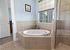 King Master Ensuite with soaking tub, separate shower and dual vanity. 