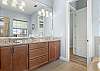 King Master Ensuite with soaking tub, separate shower and dual vanity. 