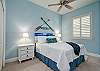 Bedroom 3 showcases a Queen bed and beachy blues.