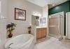 Master Bathroom features, double vanities, separate soaking tub and shower.