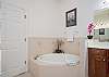 Master Bathroom with shower and separate soaking tub.