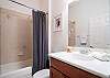 Queen Bedroom's Bathroom with shower/tub combo.