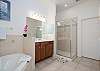 Master Bathroom with shower and separate soaking tub.