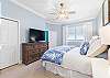 King Master Suite with a view of the ocean from the bed.