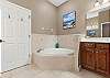 King Ensuite with dual vanity, soaking tub and separate shower. 