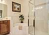 Master bathroom features a soaking tub and separate walk in shower.
