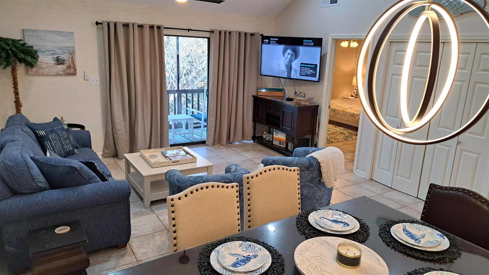 Den with Sliding Door to Private Balcony