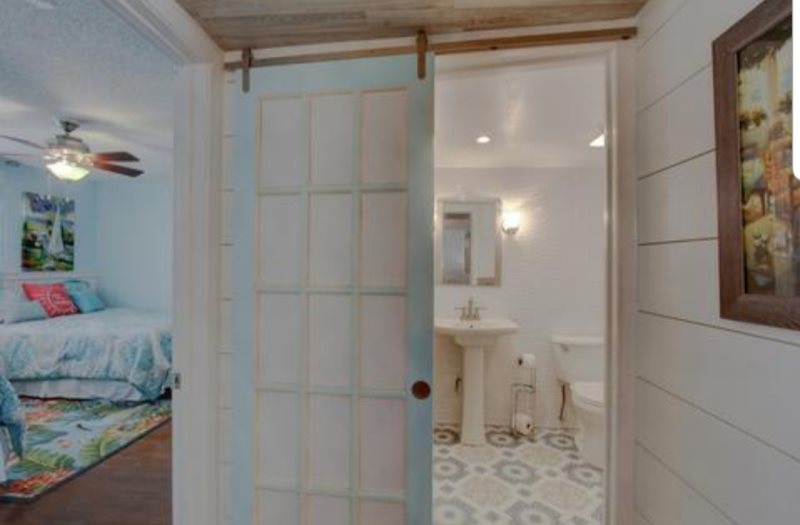 Guest Bathroom with Barn Door Next to Guest Bedroom