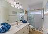 The 3rd and 4th bedroom share this spacious bathroom with walk-in shower