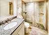 Connected master bathroom with newly renovated walk in shower.