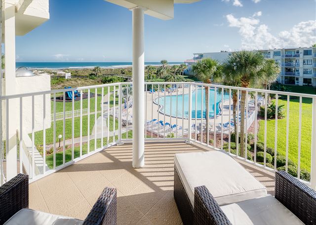 Ocean view patio features a table with seating for four and an electric grill for outdoor barbequing. Perfect spot to relax and unwind! 