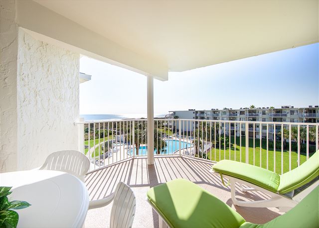 Ocean view patio features a table with seating for six and an electric grill for outdoor barbequing. Perfect spot to relax and unwind! 