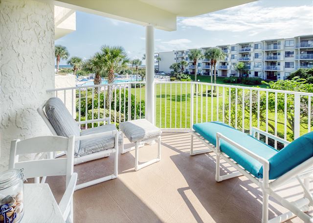 Ocean view patio features a table with seating for four and an electric grill for outdoor barbequing. Perfect spot to relax and unwind! 