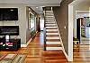 stairs leading to second floor.  Dining room on the right, living room on the left.  Bedroom down the hall on first floor