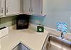 Kitchen amenities include dish soap, dishwasher detergent, a sponge, and paper towels.  Small appliances are there including  a drip coffee maker for your morning coffee.