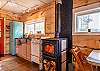 The wood stove heats the whole cabin easily