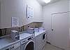 The laundry room is just off the parking area. There are 2 coin-operated washers and dryers.