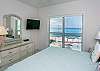 First guest bedroom storage, tv and view of Seven Mile Beach!