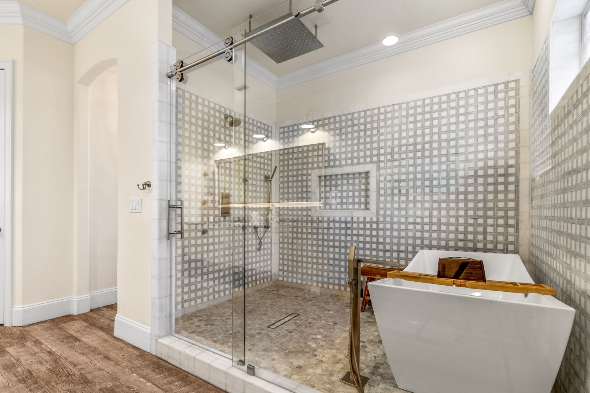 Stunning primary suite walk-in shower with rainfall shower and t