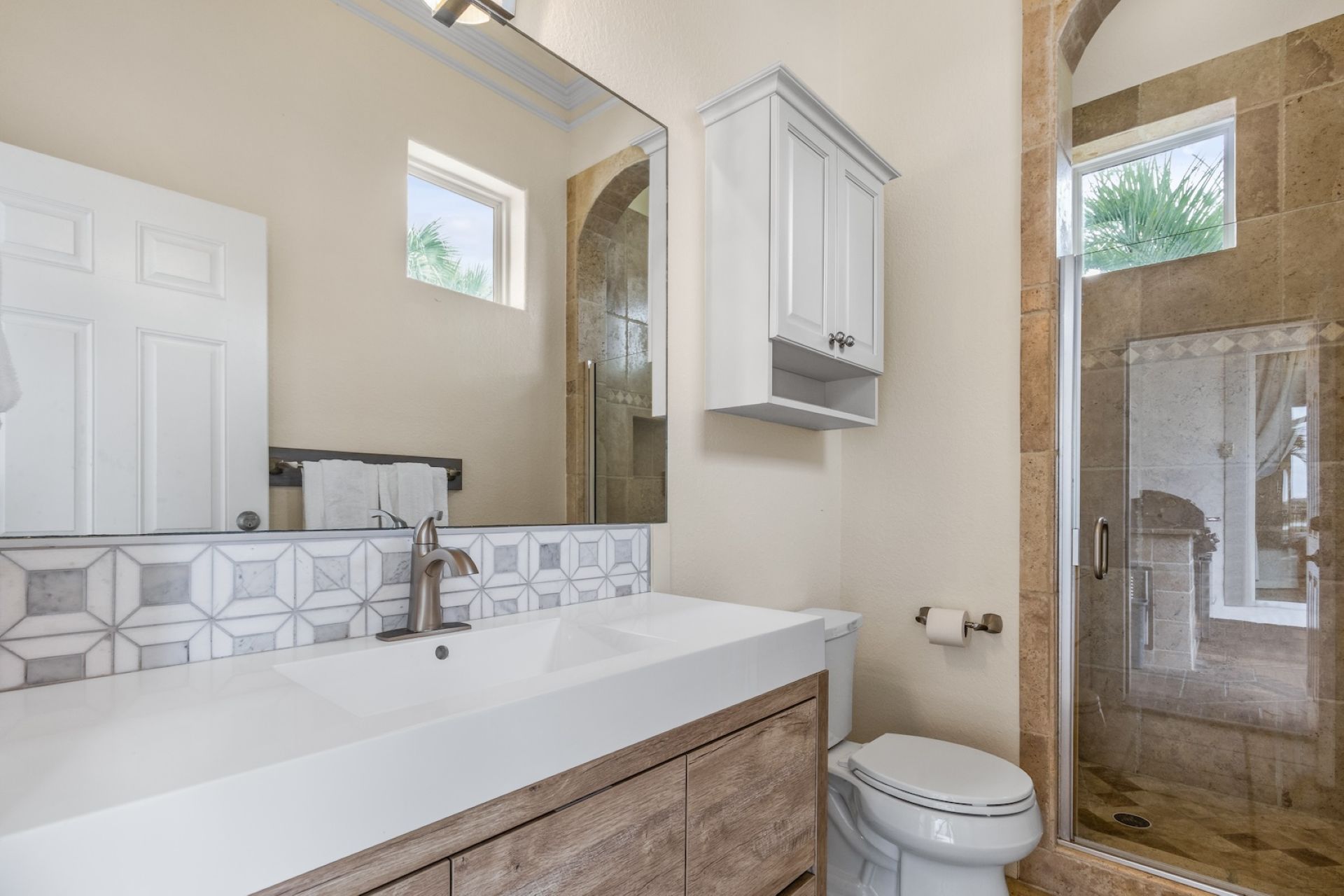 Spacious full bathroom in pool area