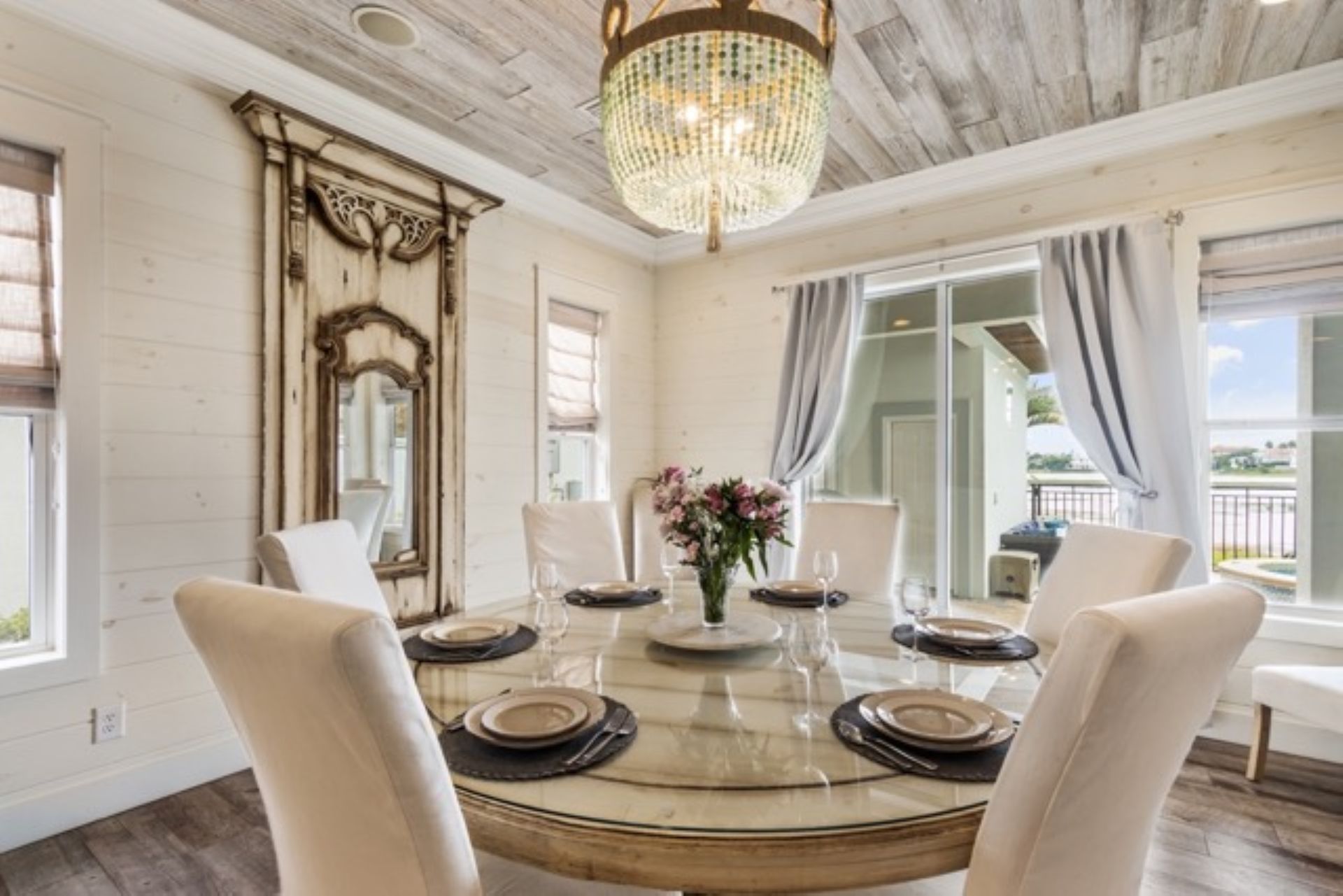 Dining room with pool and lake view