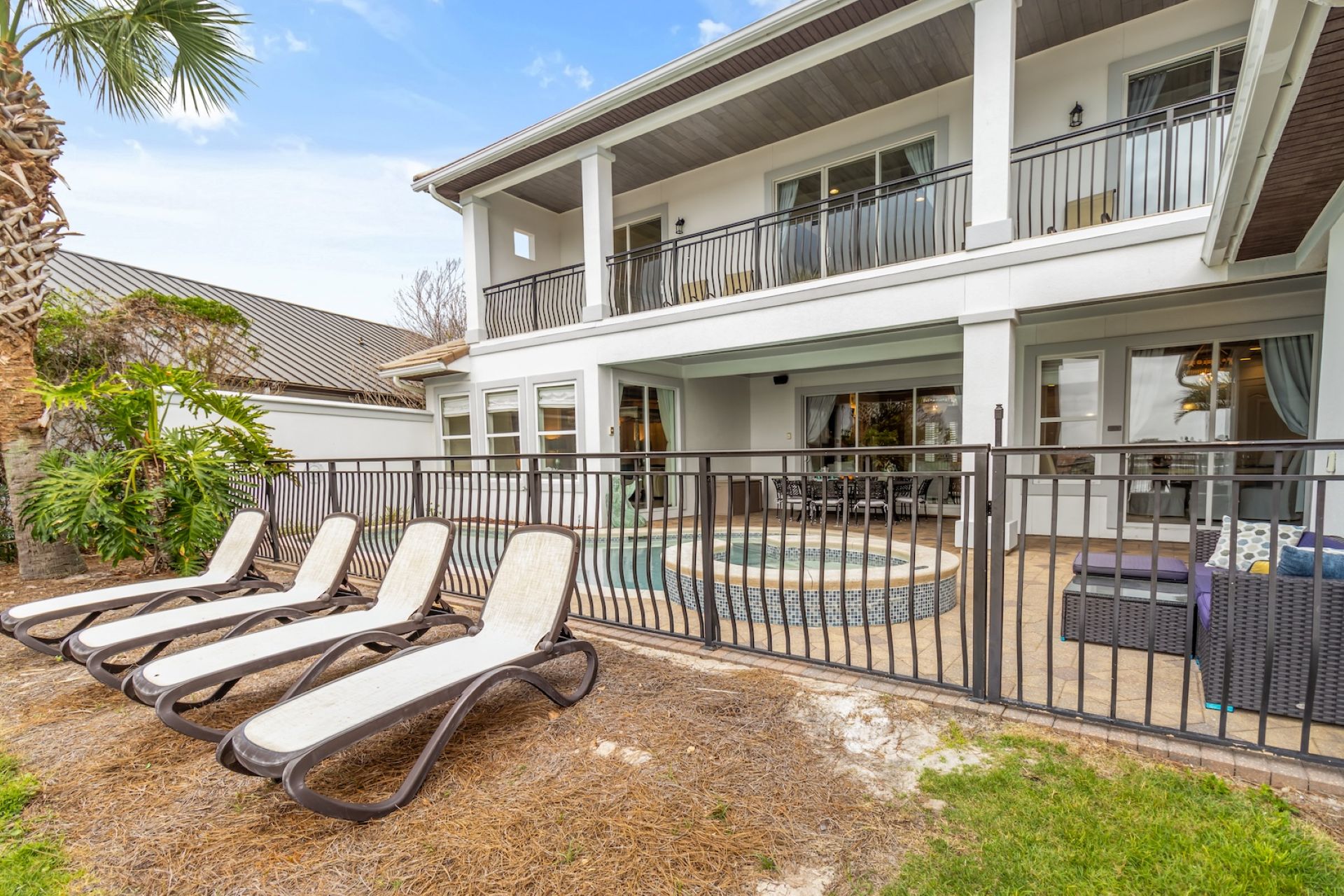 Private back patio and lounge chairs