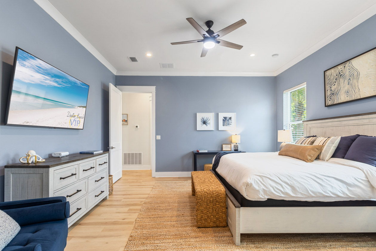 Primary suite with additional seating and large smart TV