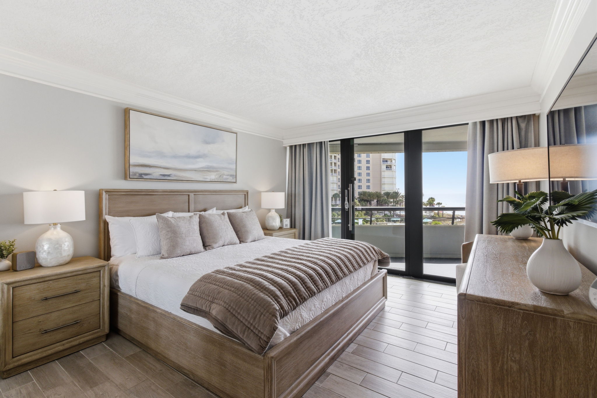 Primary suite with king bed and balcony access