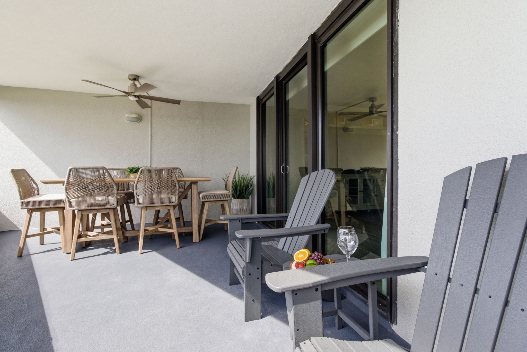 Spacious balcony with table and chairs