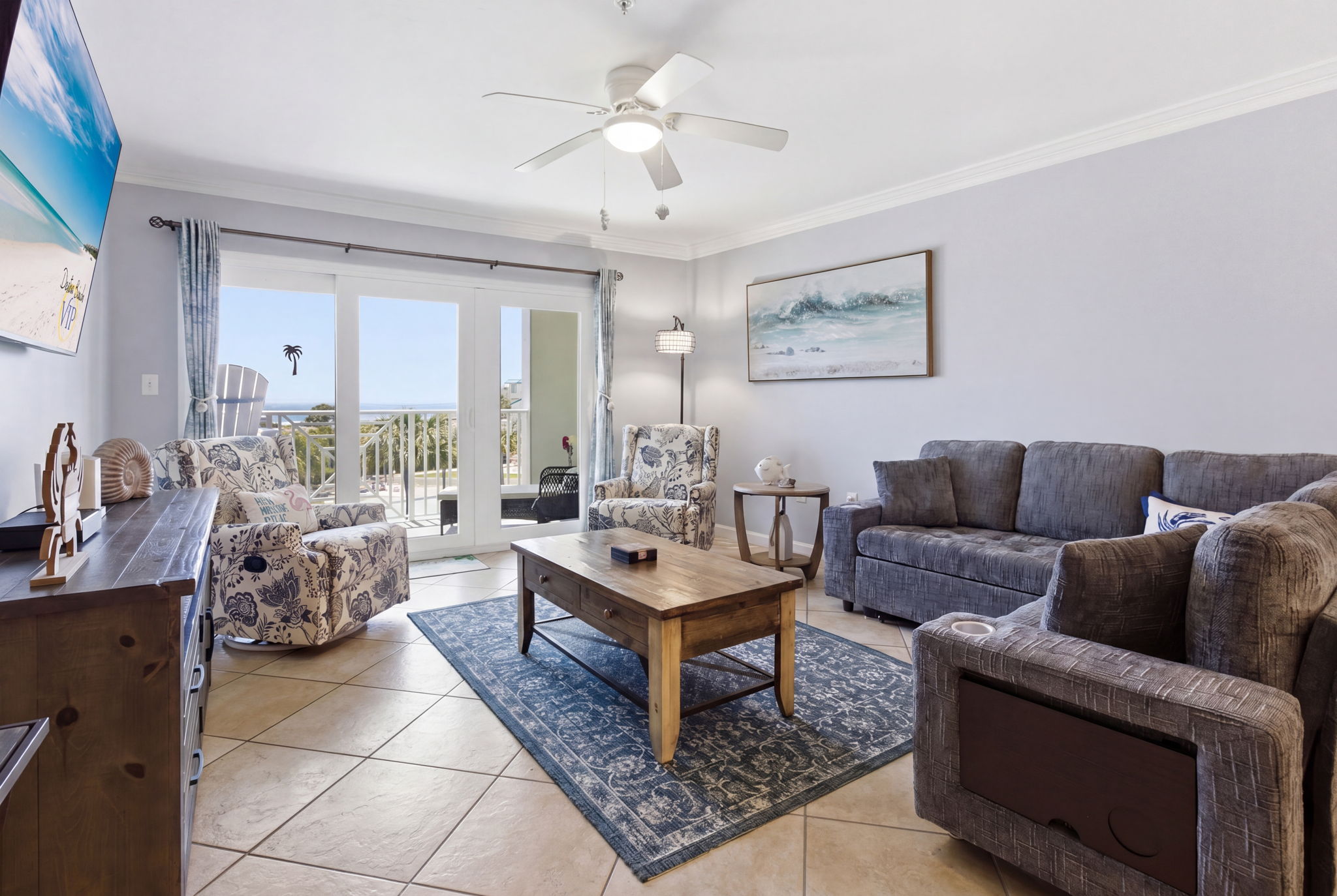 Spacious living area with a large couch and chairs