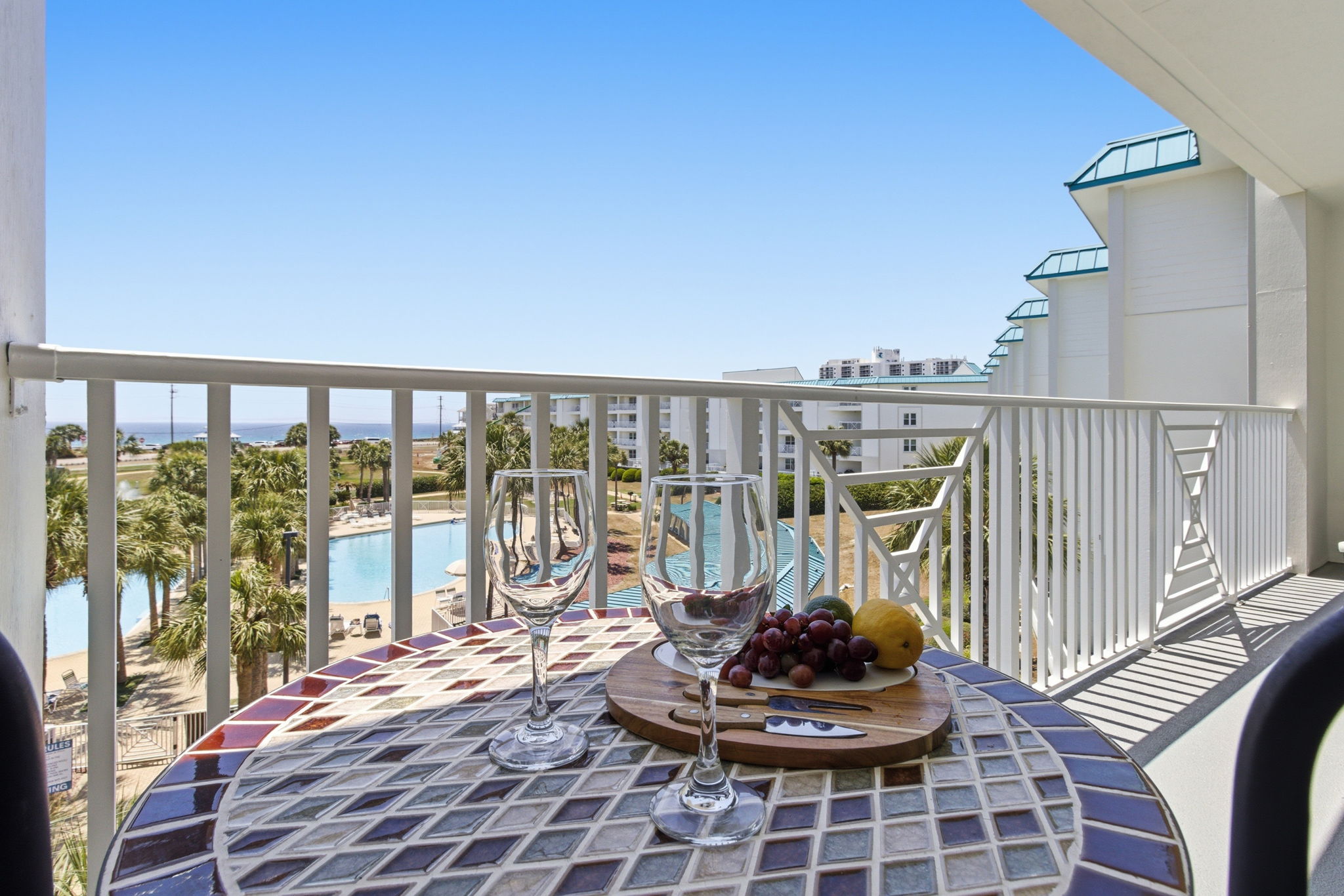 Balcony dining with pool and gulf views