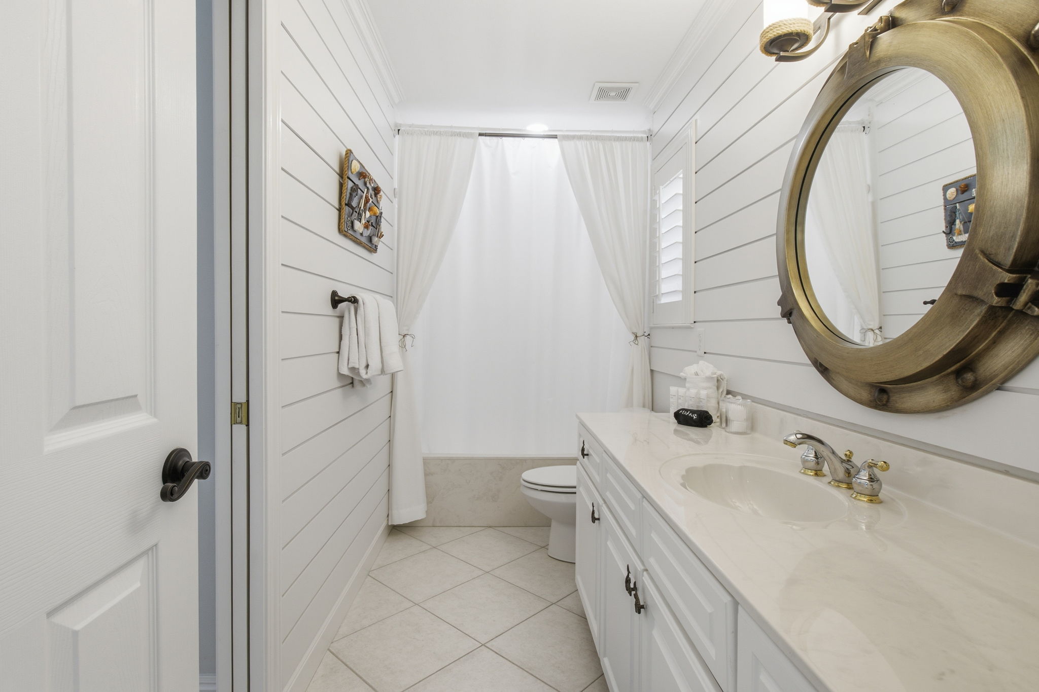 Second floor shared bathroom with hallway entrance