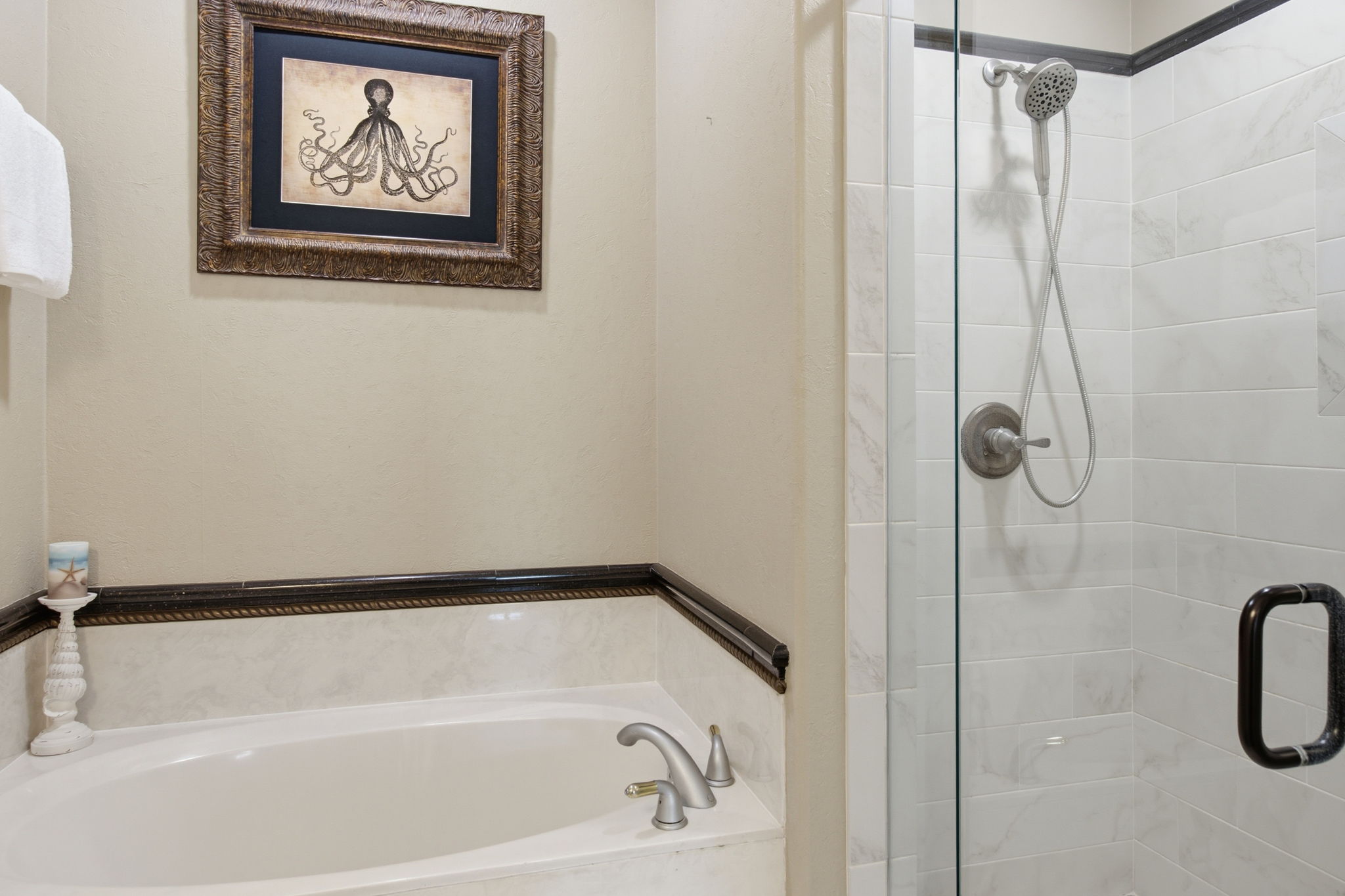 Primary ensuite with walk-in shower and stand alone tub