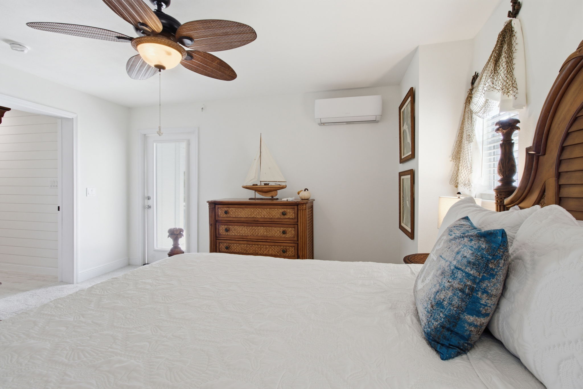 Second floor queen guest room with balcony access