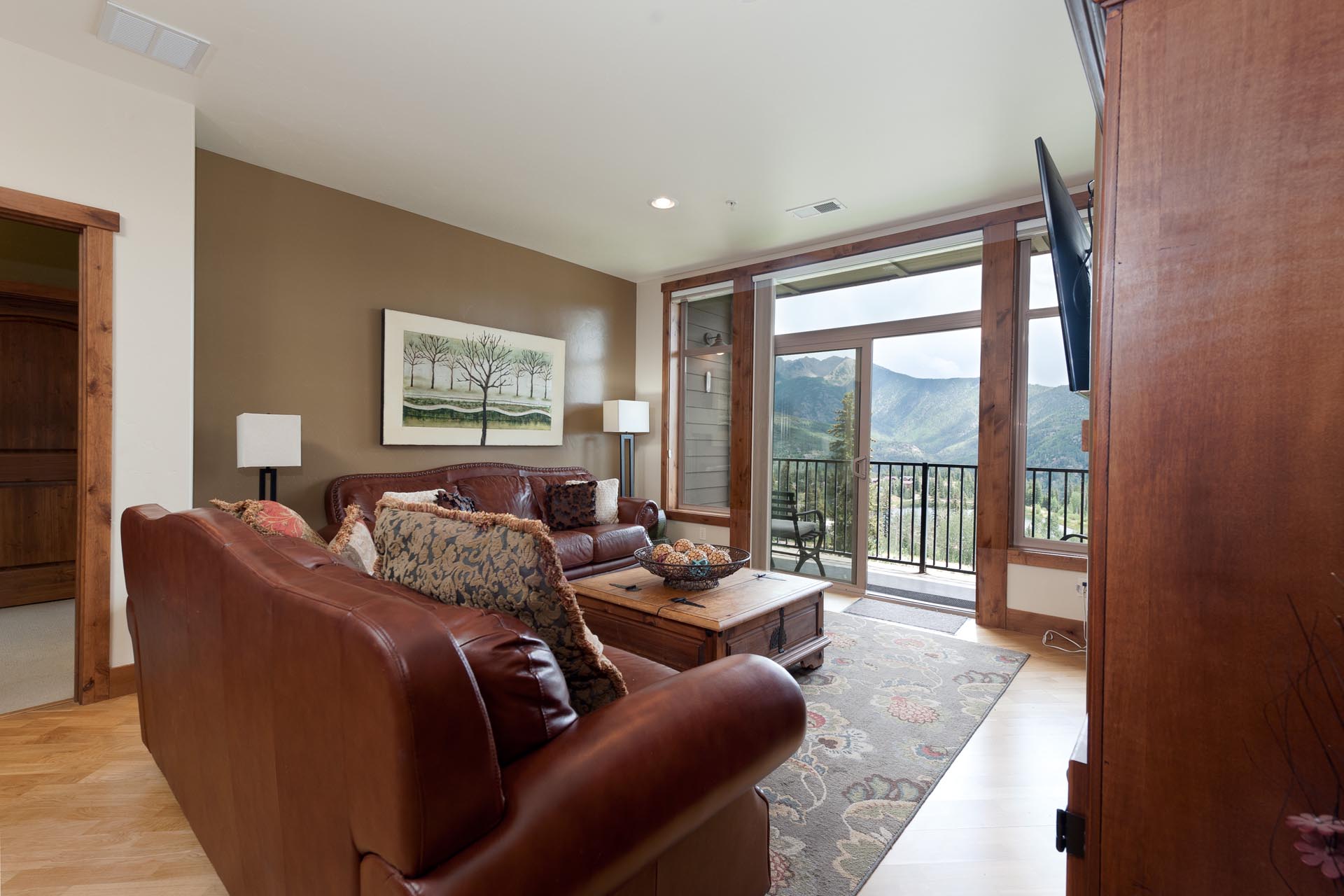 Main Living Space - Gas Fireplace, TV and Deck with awesome views