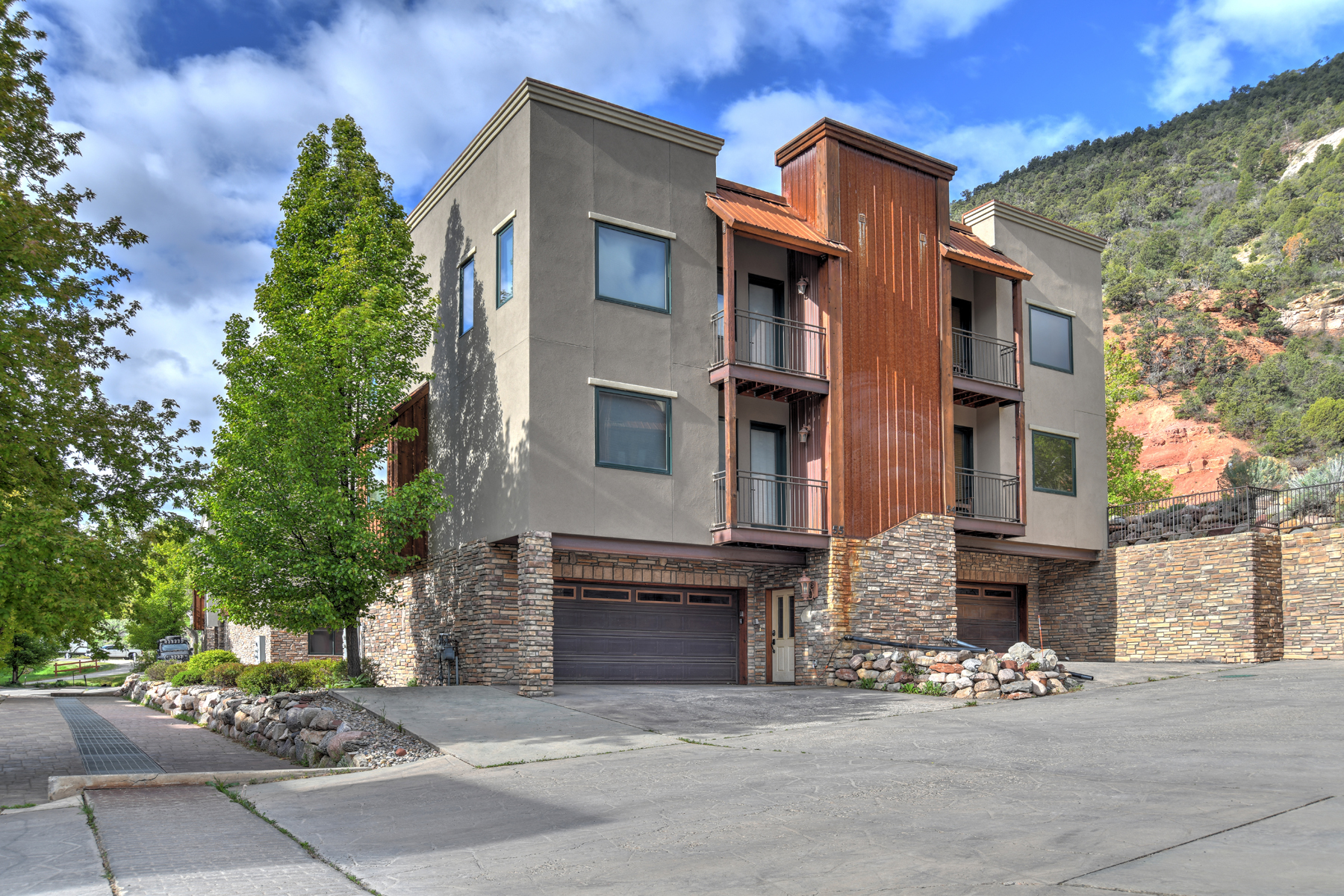 Exterior view - Unit 55 is on the left side of the duplex
