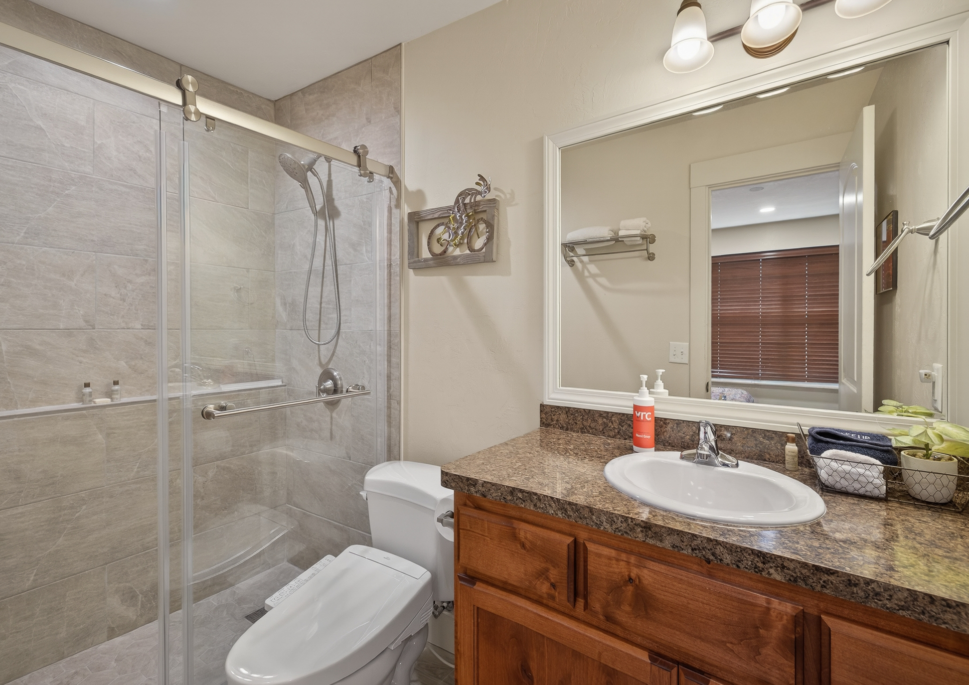 recently remodeled master bathroom with walk in shower and bidet feature