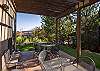 Backyard and patio with plenty of seating and a grill