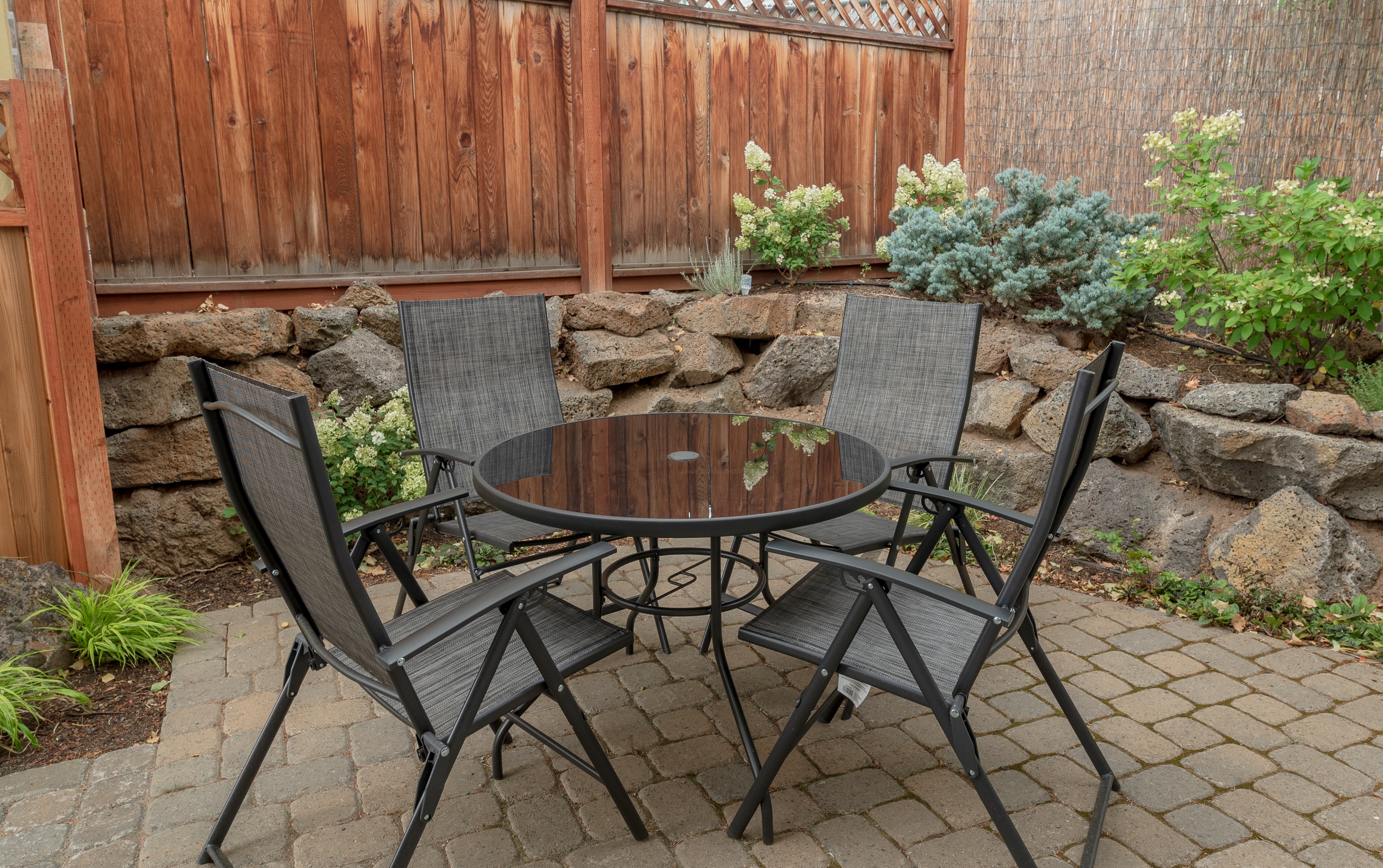 Outdoor dining area on the patio with seating for 4.